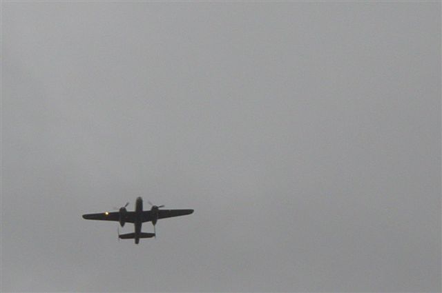 Fly by, ww2 bomber B25. Bombers of this type did not fly in the actual food drop missions.